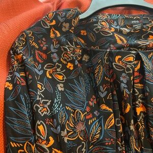 Intro. Vibrant Black Top with Floral Patterns